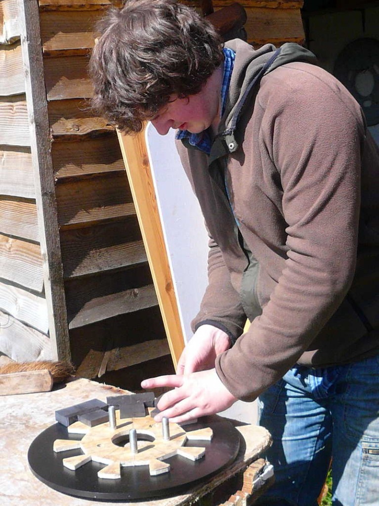Benji puts the poles in place on the second rotor
