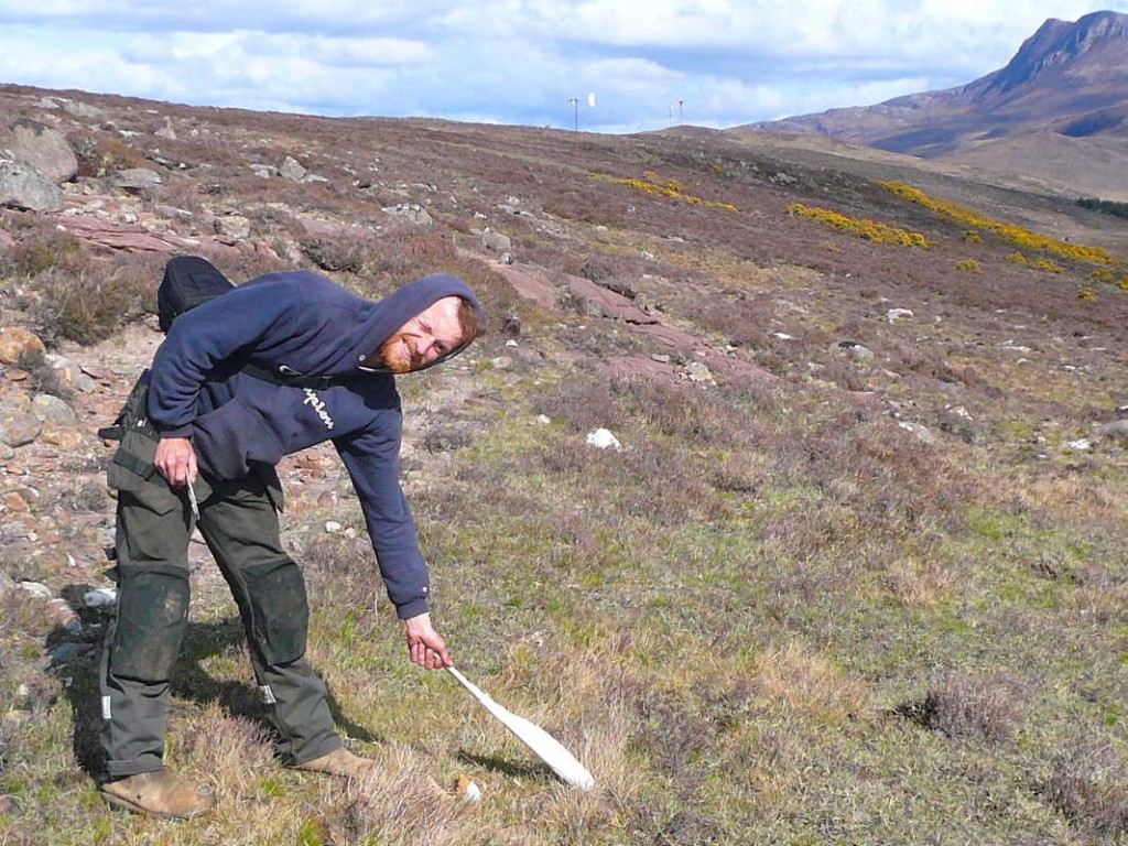 Kern finds a blade embedded in the ground and pulls it out.