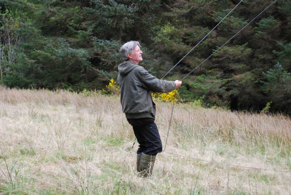 Holding the back guys to stop the gin pole falling